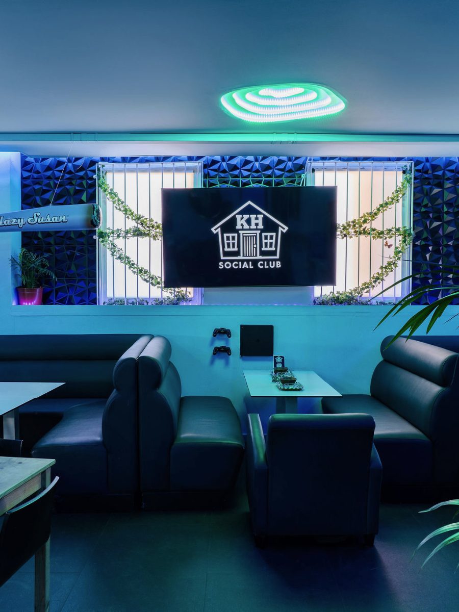 Leather booth seating and low tables in the Kush House lounge.