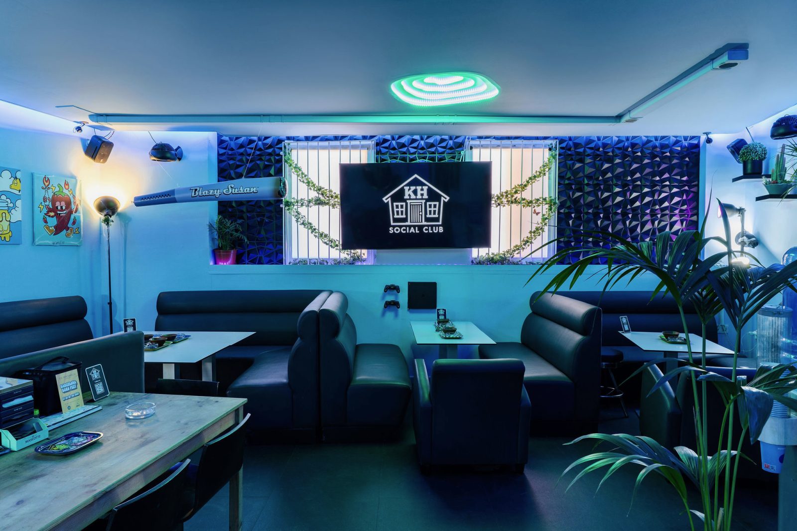 Leather booth seating and low tables in the Kush House lounge.